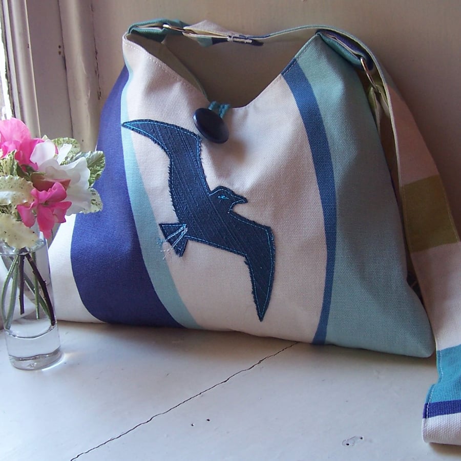 Soft textile shoulder bag with machine embroidered bird applique - Gull