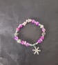 Elasticated beaded winter bracelet with crystal chip and silver snowflake charm  - Image 4