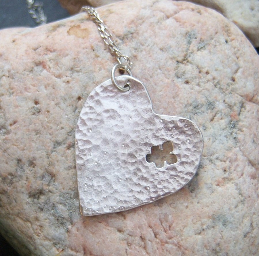 Heart pendant with jigsaw piece in sterling silver