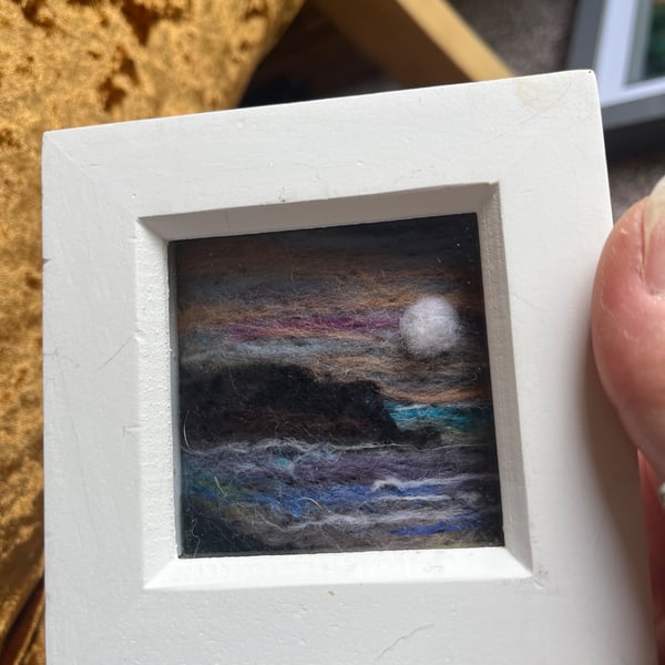 Peach purple Sunset over cliffs and sea needle felt  white box frame 