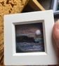 Peach purple Sunset over cliffs and sea needle felt  white box frame 