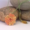 Crochet carnation necklace in orange, yellow and green - naomi
