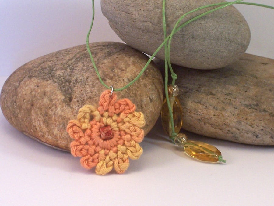 Crochet carnation necklace in orange, yellow and green - naomi