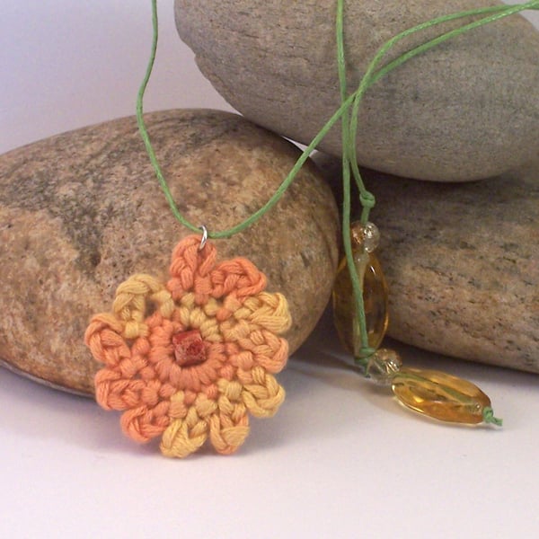 Crochet carnation necklace in orange, yellow and green - naomi