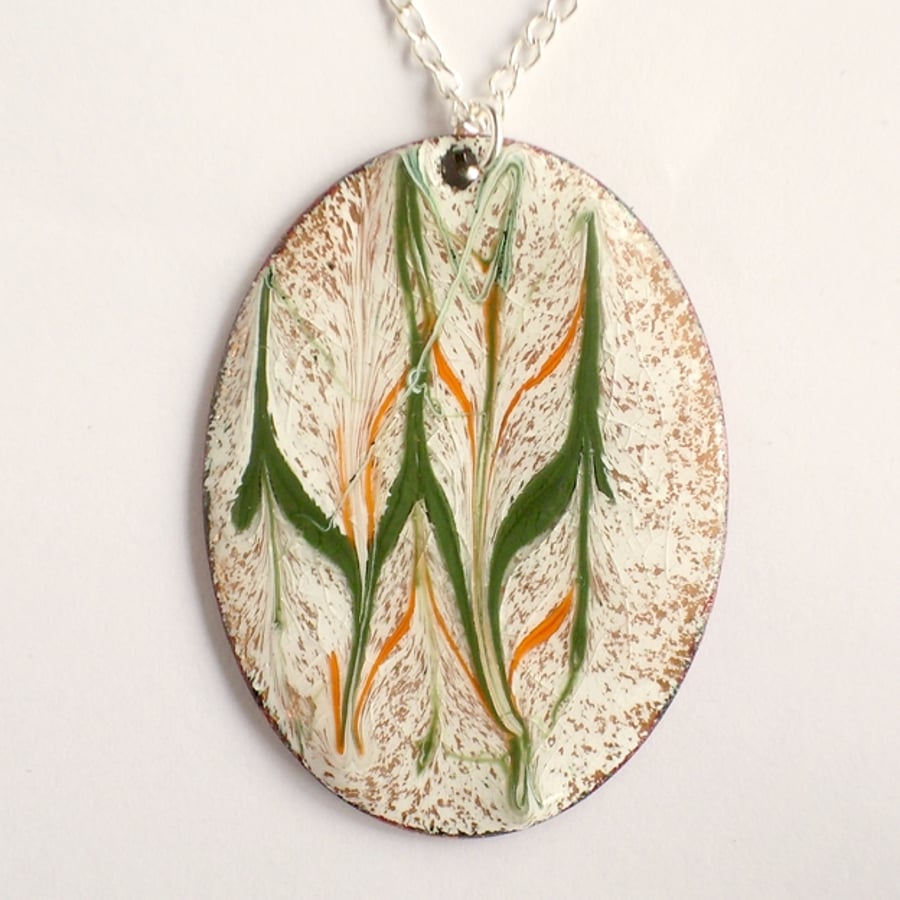 pendant - oval scrolled orange and green on white over clear enamel