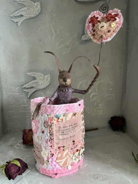 Paper mache hare in hand stitched fabric art pot