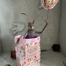Paper mache hare in hand stitched fabric art pot