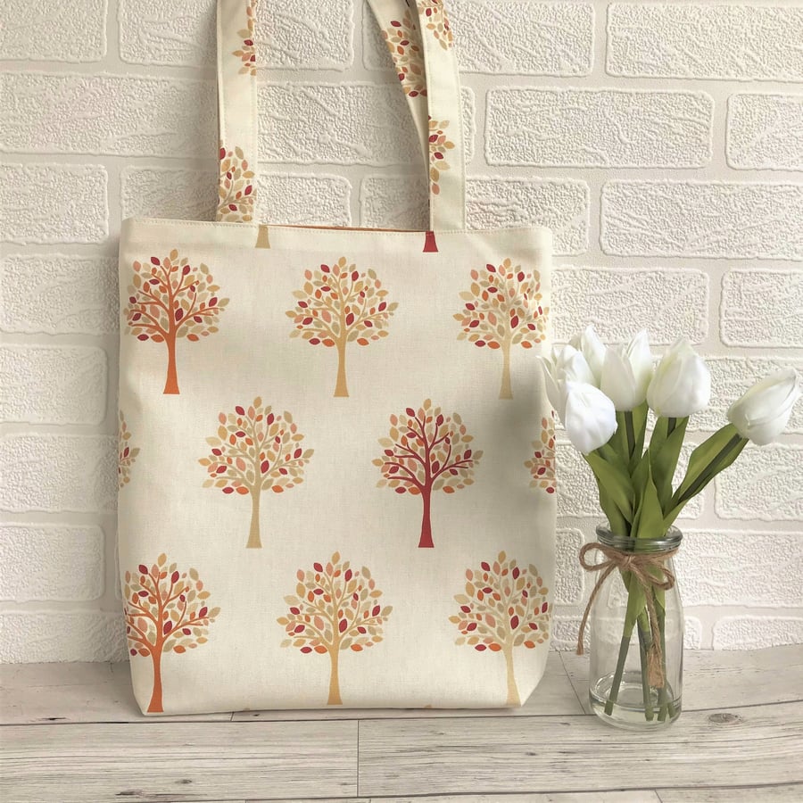 Woodland tote bag in cream with trees pattern in Autumn colours