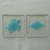 Turtle and Manta Ray blue bubble fused glass coasters. Set of two