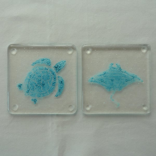 Turtle and Manta Ray blue bubble fused glass coasters. Set of two