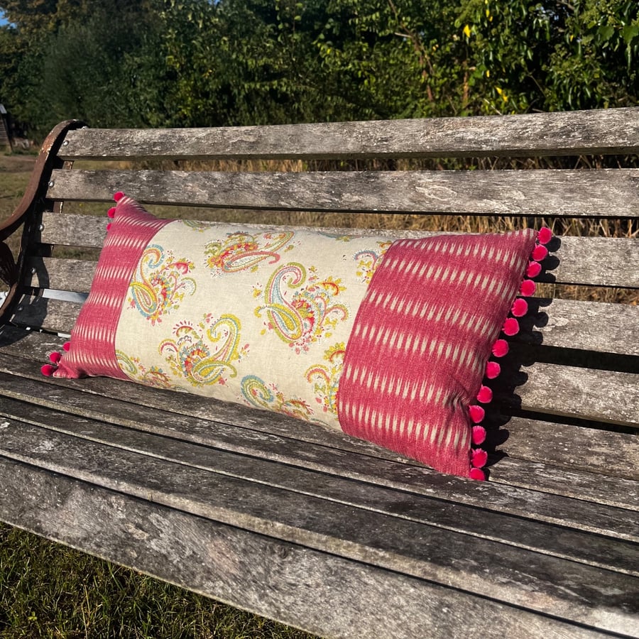 Long linen feature cushion with pompom trim