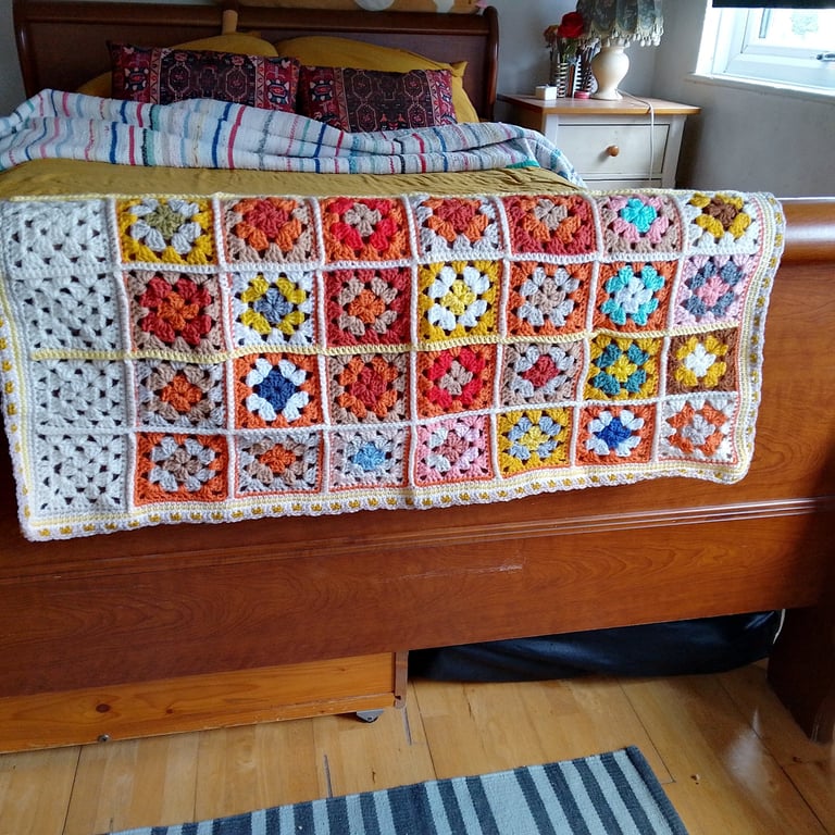 baby or toddler blanket handmade in an orange and yellow colourway.