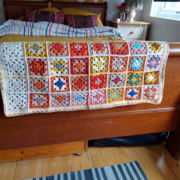 baby or toddler blanket handmade in an orange and yellow colourway.