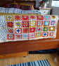 baby or toddler blanket handmade in an orange and yellow colourway.