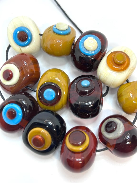 Handmade brown, ivory and turquoise spotty lamp work glass beads