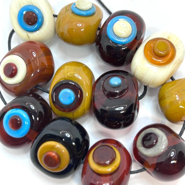 Handmade brown, ivory and turquoise spotty lamp work glass beads
