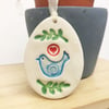 Pottery Easter Egg decoration with blue bird and leaves