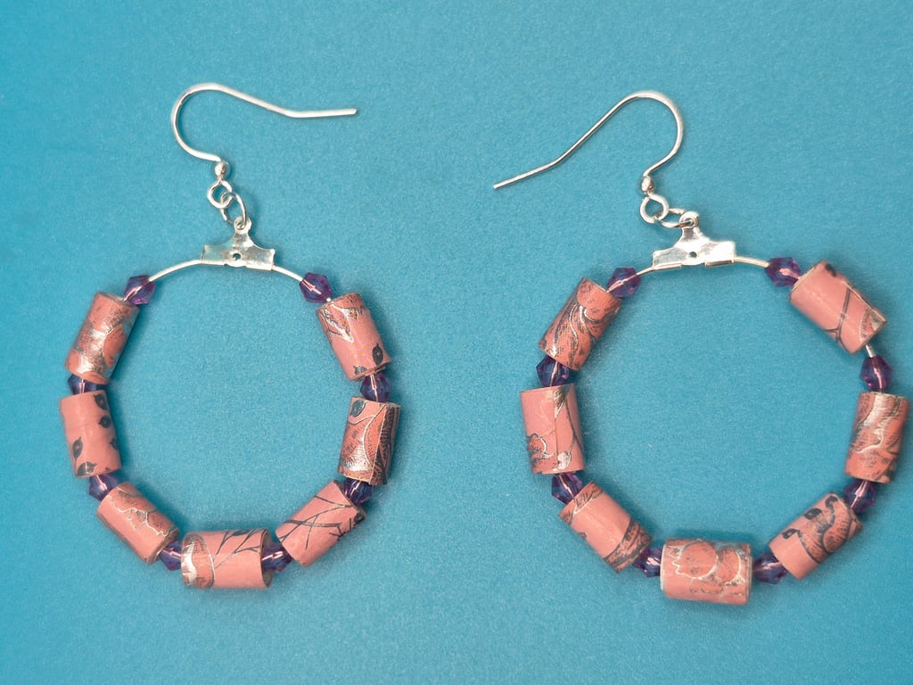 Hoop earrings threaded with with dusky pink paper beads
