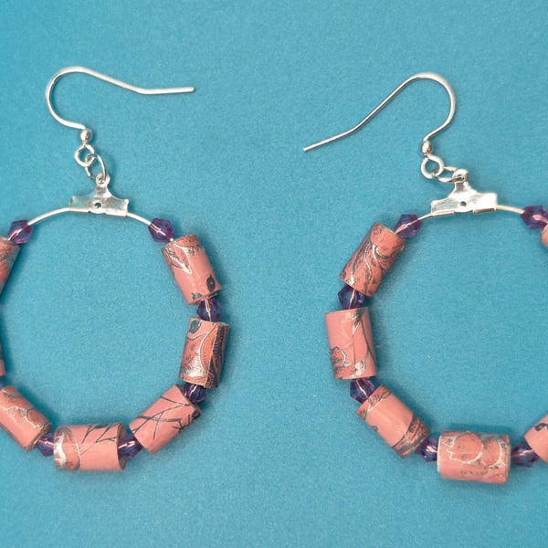 Hoop earrings threaded with with dusky pink paper beads