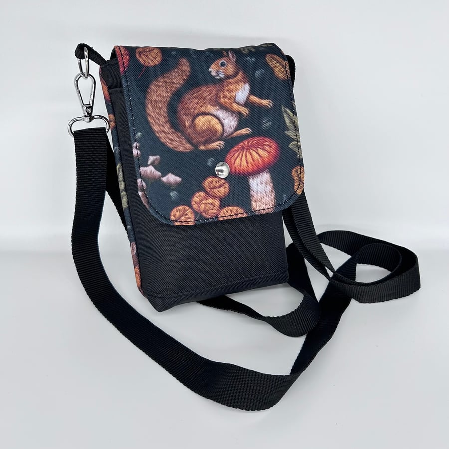 Mini cross body bag with squirrel and mushroom print on waterproof canvas.