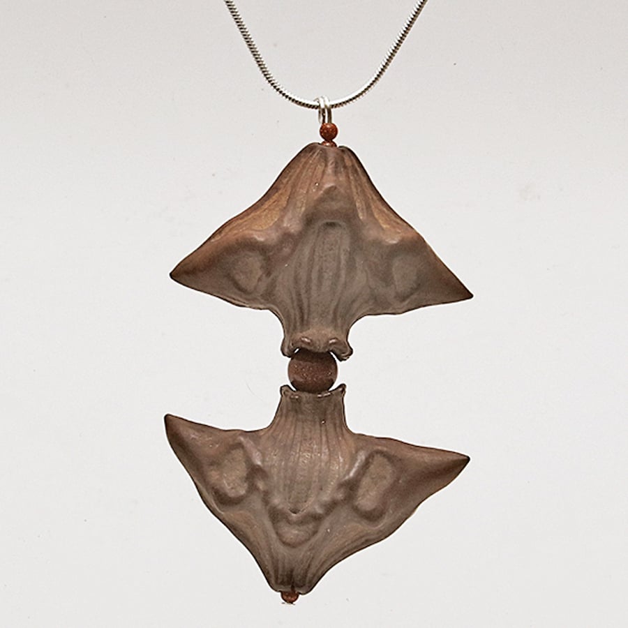 Goldstone-Caltrop Pendant