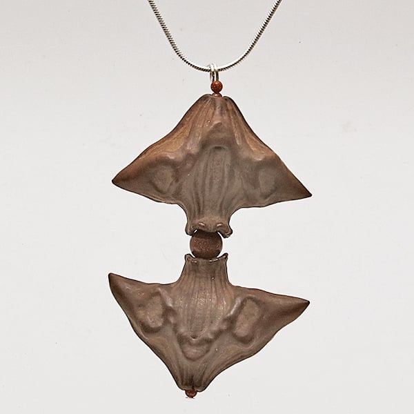 Goldstone-Caltrop Pendant