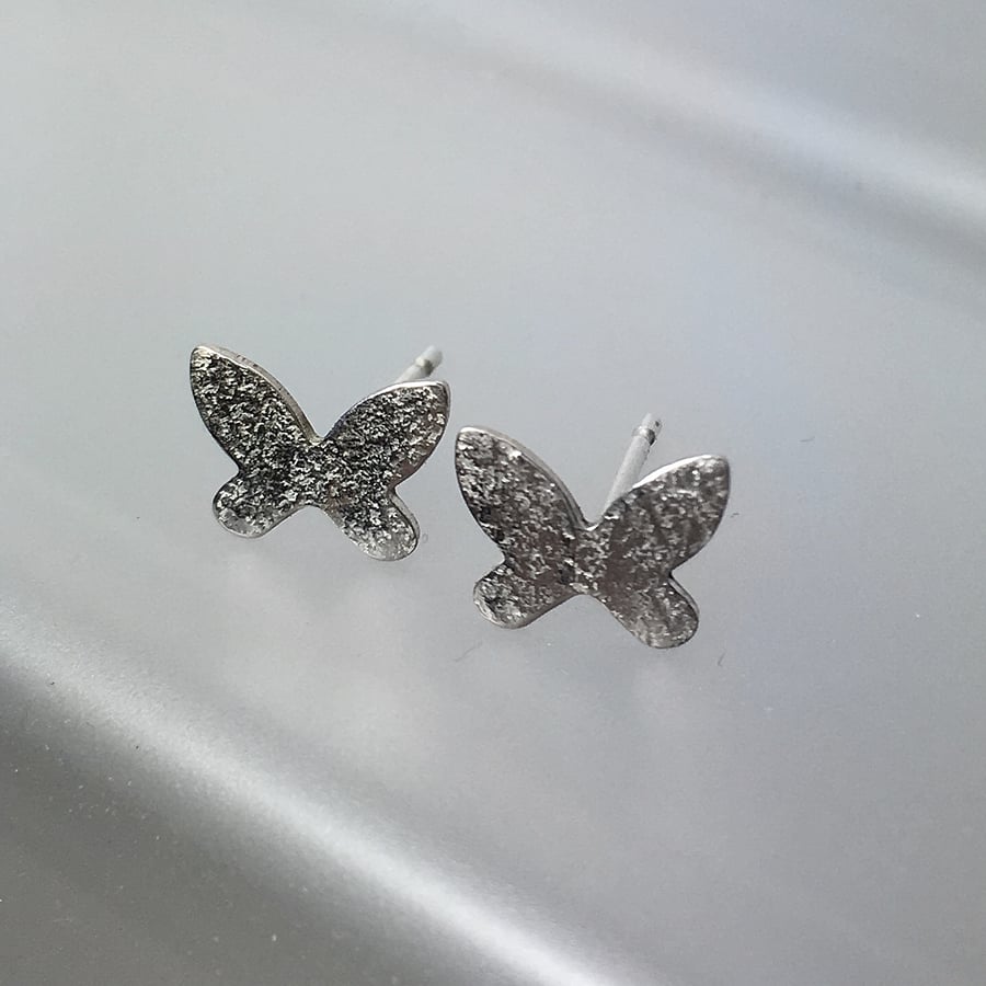 Tiny silver butterfly stud earrings