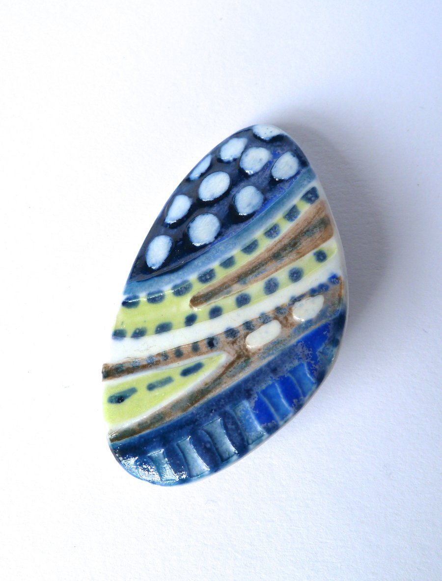  A unique painted porcelain brooch, hand made in Winchester.