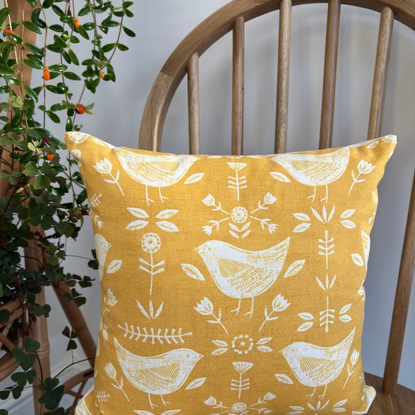 Cushion cover with a Scandi bird and flower print in ochre, 36cm x 36cm
