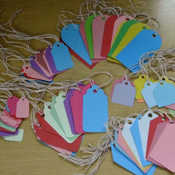 60 gift tags assorted shaped Sizzix die cuts for card embellishments & crafting.