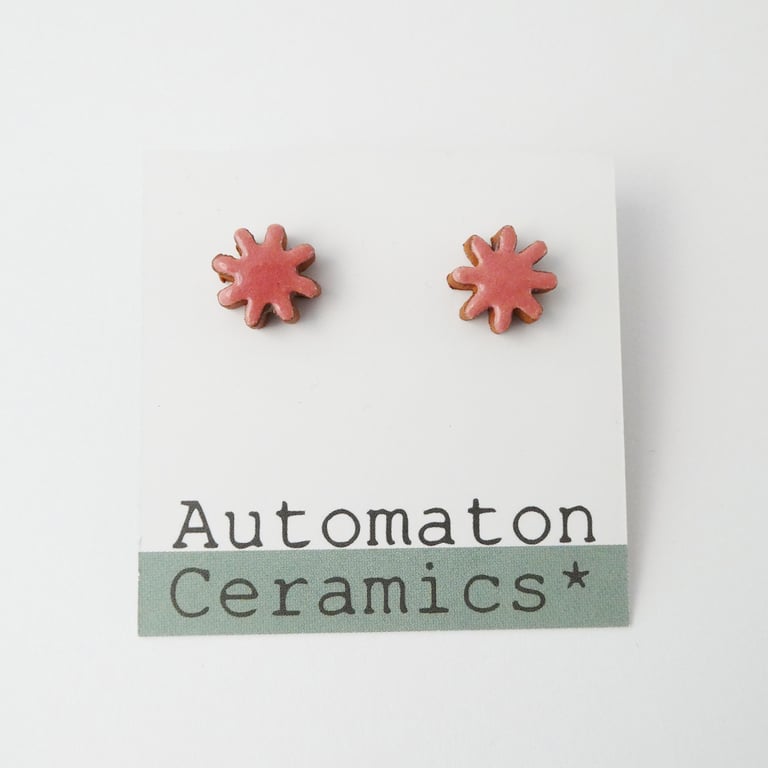 Starburst stud earrings, pink.