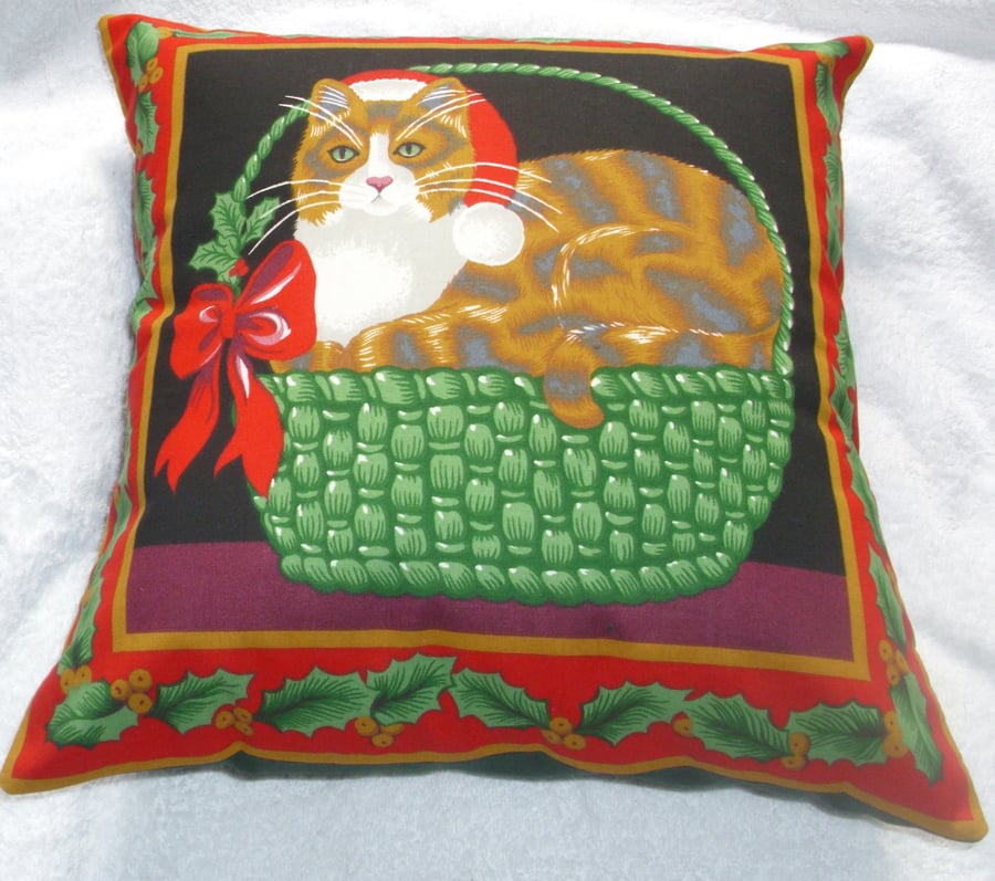 A lovely ginger and white tabby cat in Christmas basket cushion