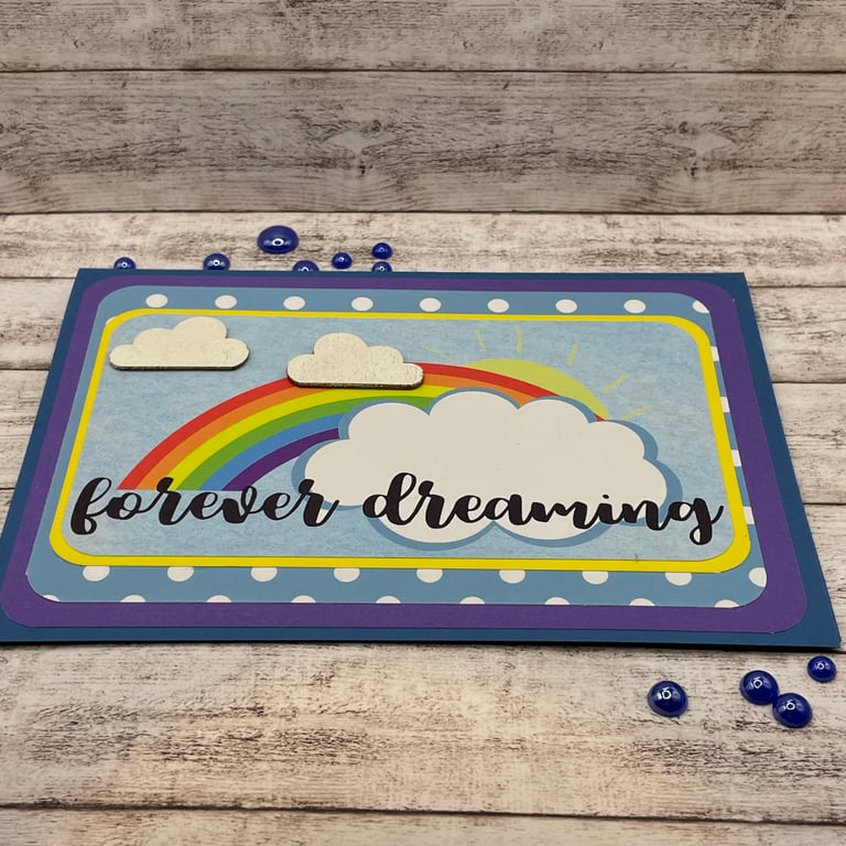bright rainbow birthday card with "forever dreaming" motto