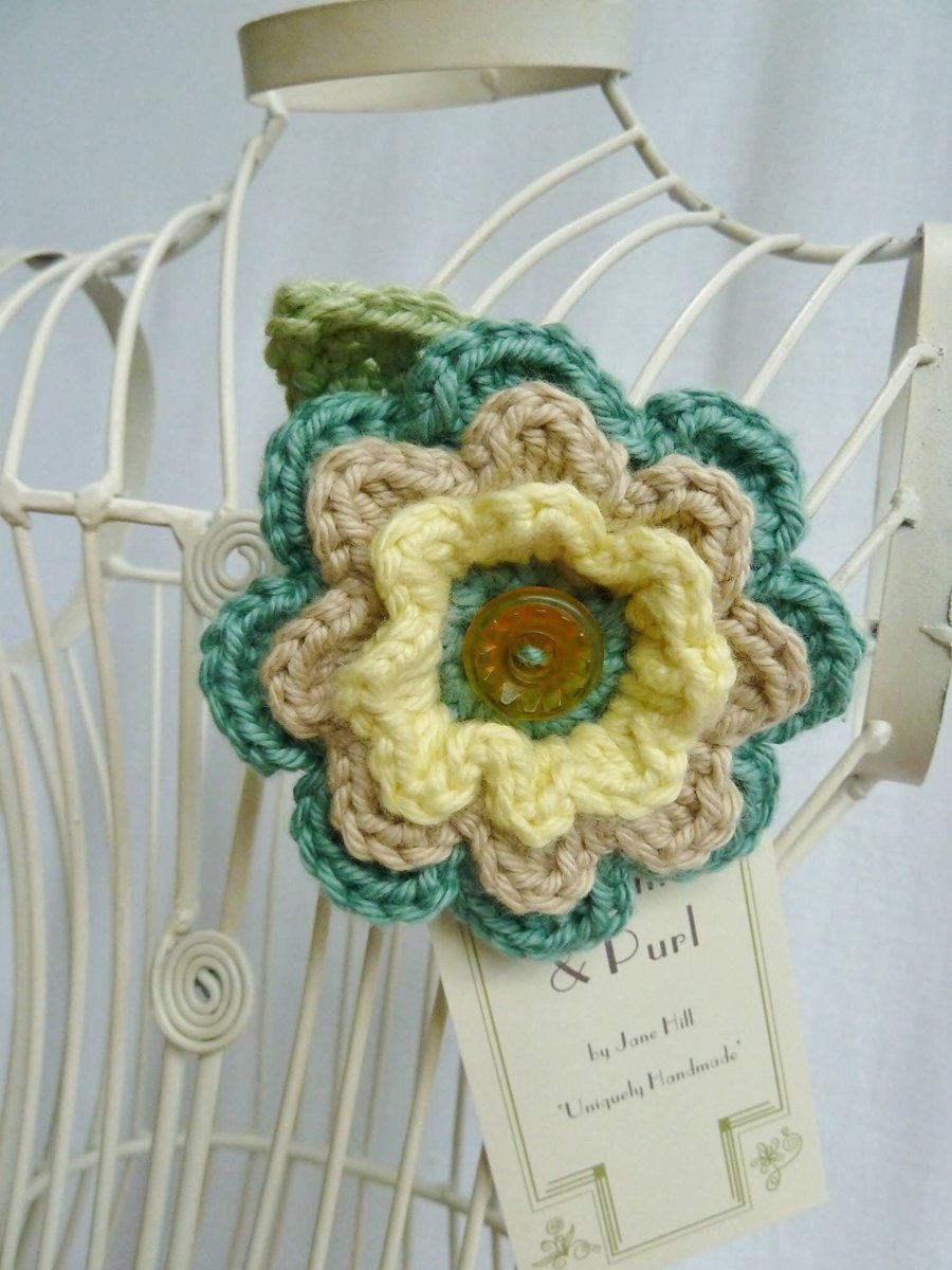 Crochet flower brooch in soft pastel shades. FREE UK P & P.