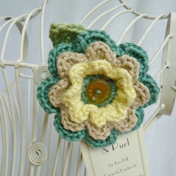 Crochet flower brooch in soft pastel shades. FREE UK P & P.