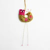 Marzipan coloured felt hanging bird ornament with folk embroidery