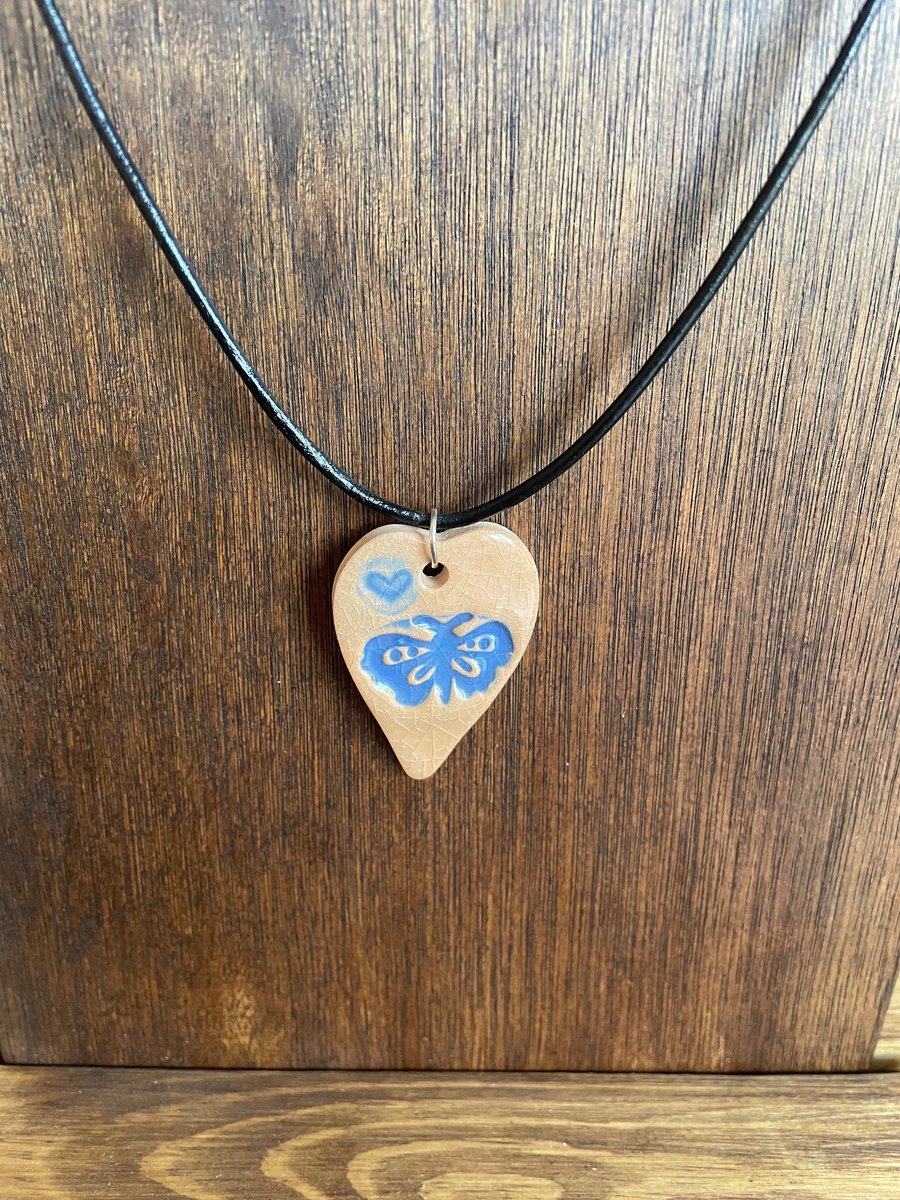 Blue butterfly heart pendant