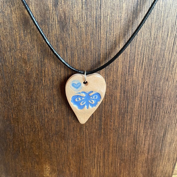 Blue butterfly heart pendant
