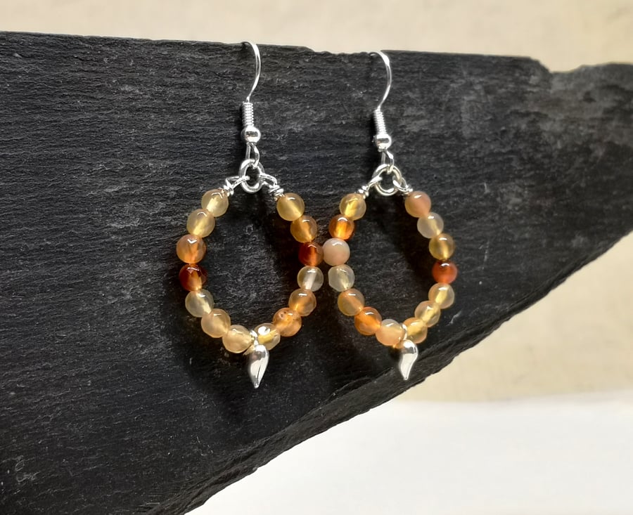 Carnelian hoop earrings with heart charm, July birthstone
