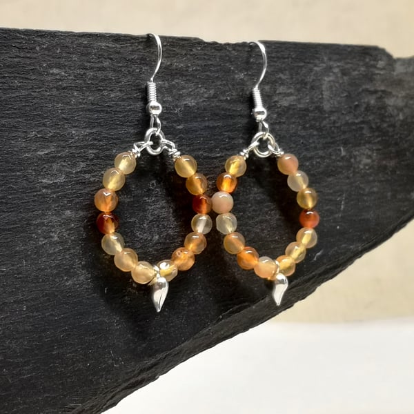 Carnelian hoop earrings with heart charm, July birthstone