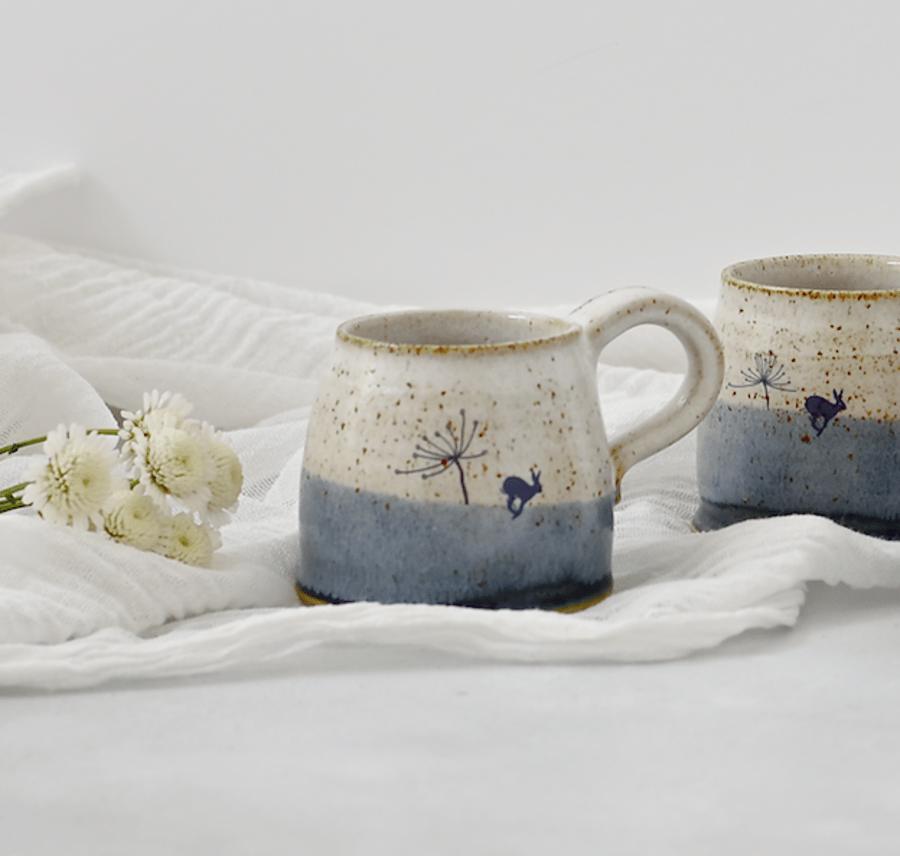 Handmade blue and white ceramic mug with running hare - stoneware pottery