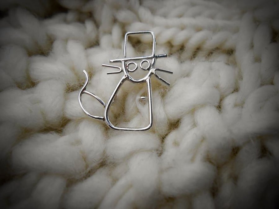 Teeny tiny cat in the style of a childs drawing. 