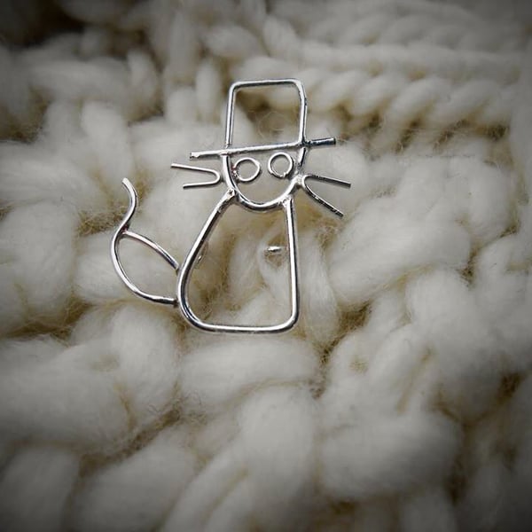 Teeny tiny cat in the style of a childs drawing. 