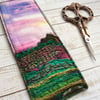Embroidered up-cycled sunset landscape bookmark. 