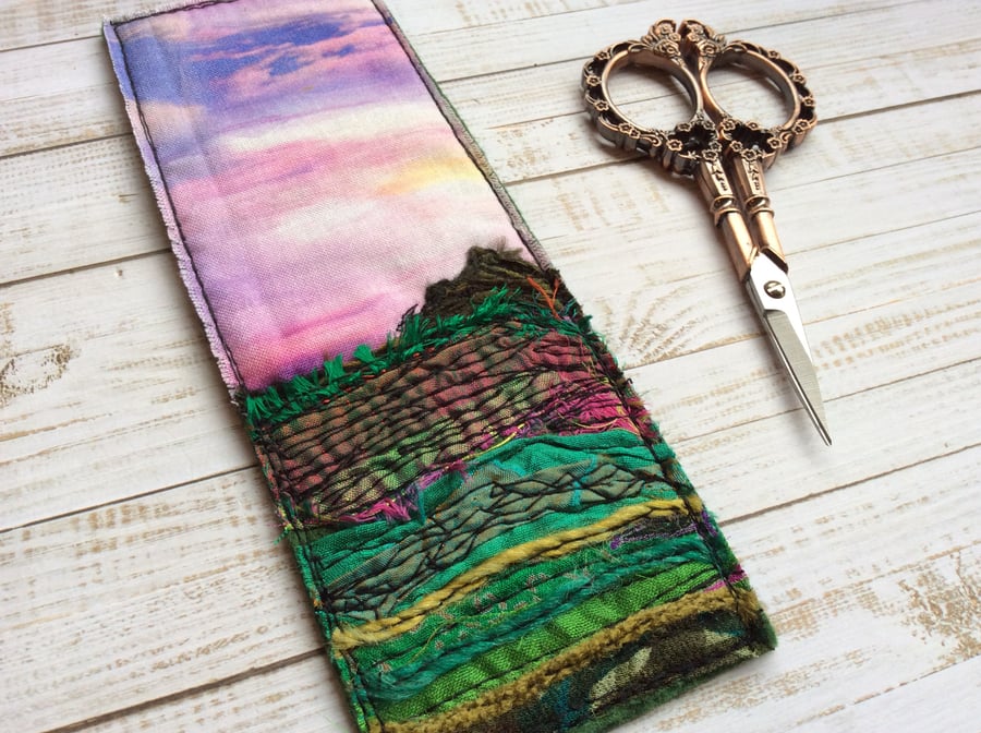 Embroidered up-cycled sunset landscape bookmark. 