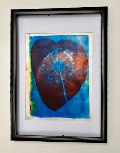 Hand printed flower in a heart picture.