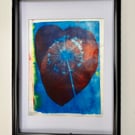 Hand printed flower in a heart picture.