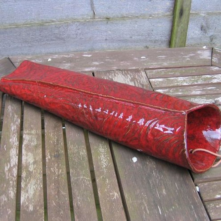 Wall vase with textured pattern.