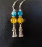 Silver lighthouse charm dangle earrings with yellow and blue beads - Image 5
