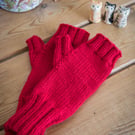 Fingerless mittens, hand knit in a bright red colour, using soft washable wool
